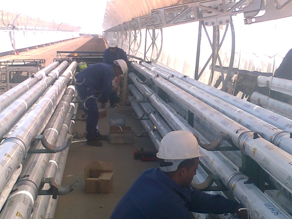 Technicians installing solar panels